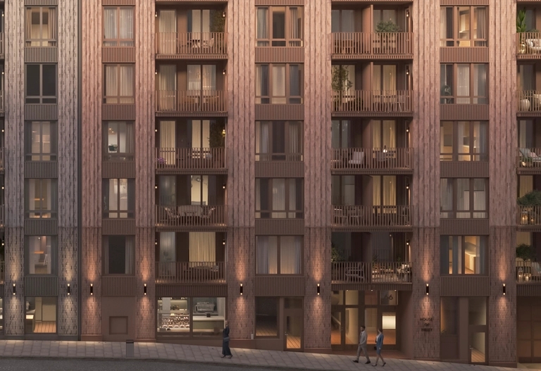 House of Nelly. Modernt flerbostadshus med stora fönster, balkonger och människor som går på trottoaren framför.