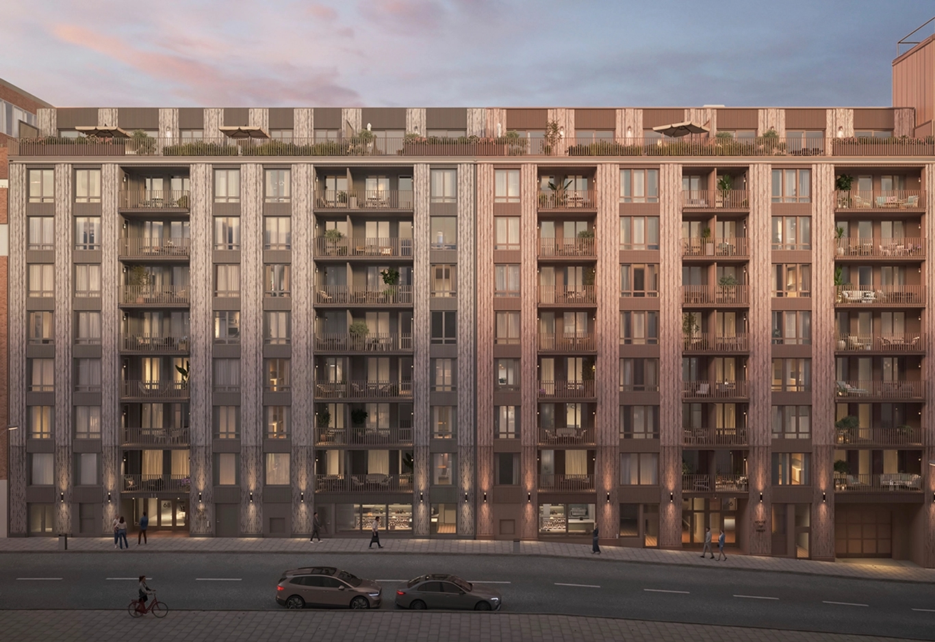 Flerfamiljshus med indragna balkonger och stora takterrasser.