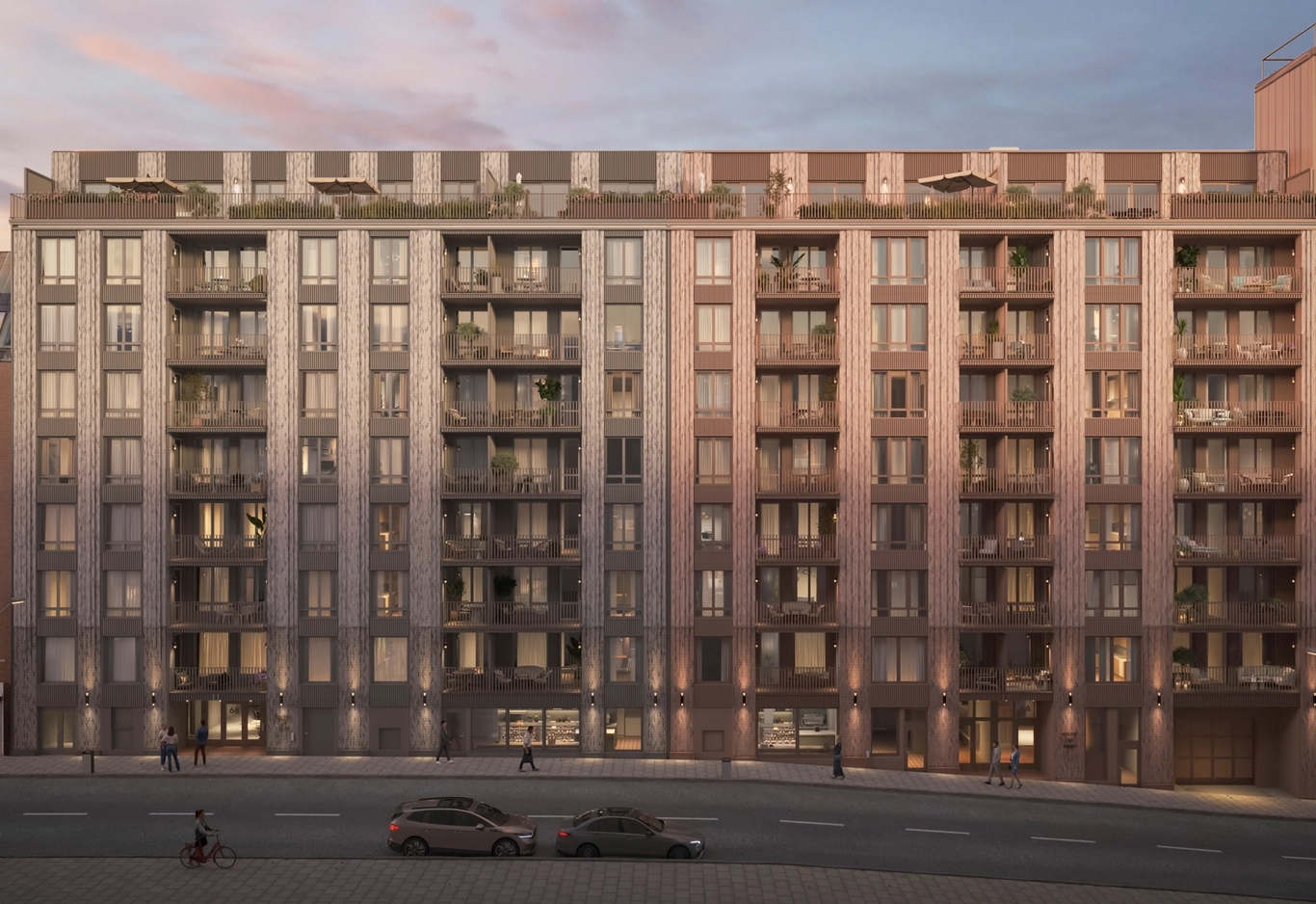 House of Nelly. Ett modernt flerfamiljshus vid Nordenflychtsvägen med balkonger och stora fönster i solnedgången, med bilar parkerade framför.