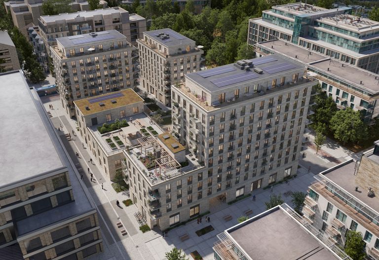 Fransyskan exteriör över hela kvarteret med tegelfasad, takterrasser och balkonger. Gemensam takterrass med pergola.